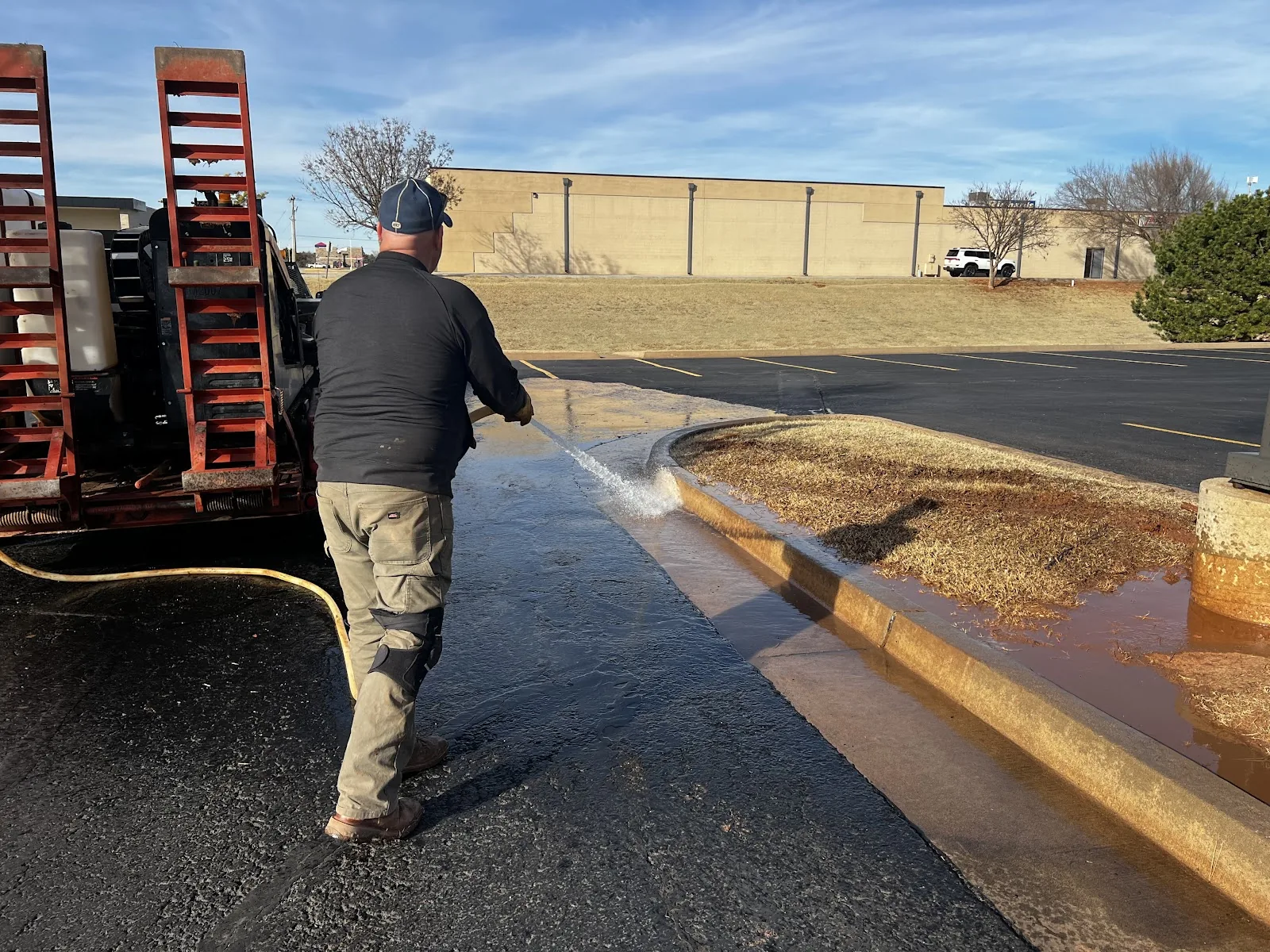 Directional drilling rig and crew on an open field utility bore