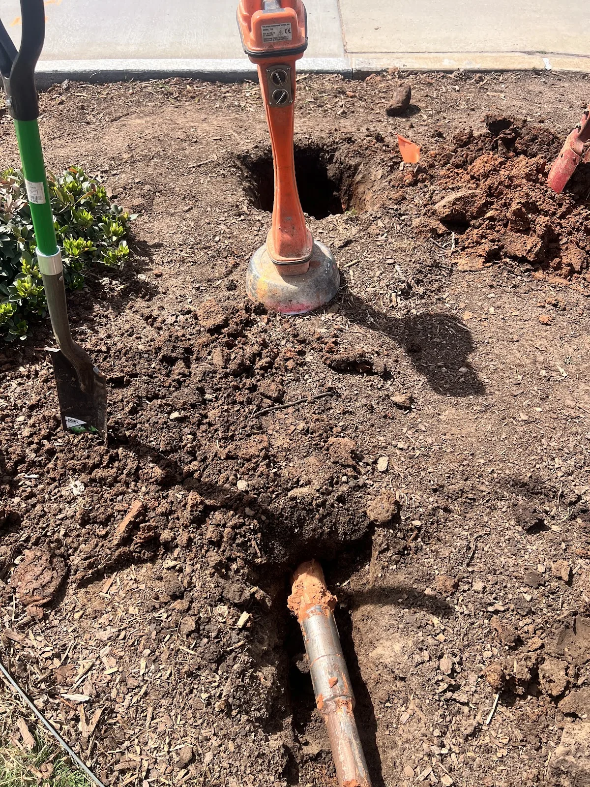 Completed bore pit with utility conduit ready for backfill