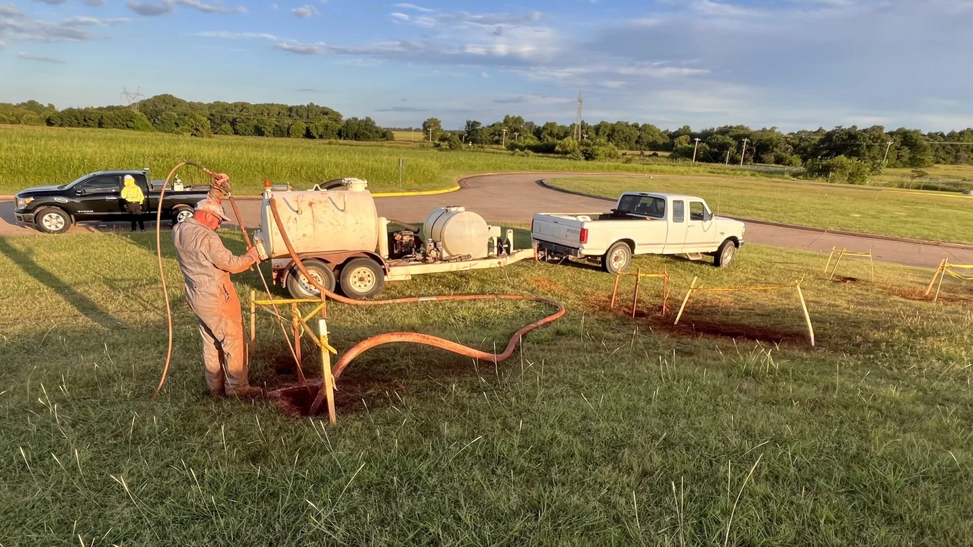 Crew operating a directional drill along a street utility corridor